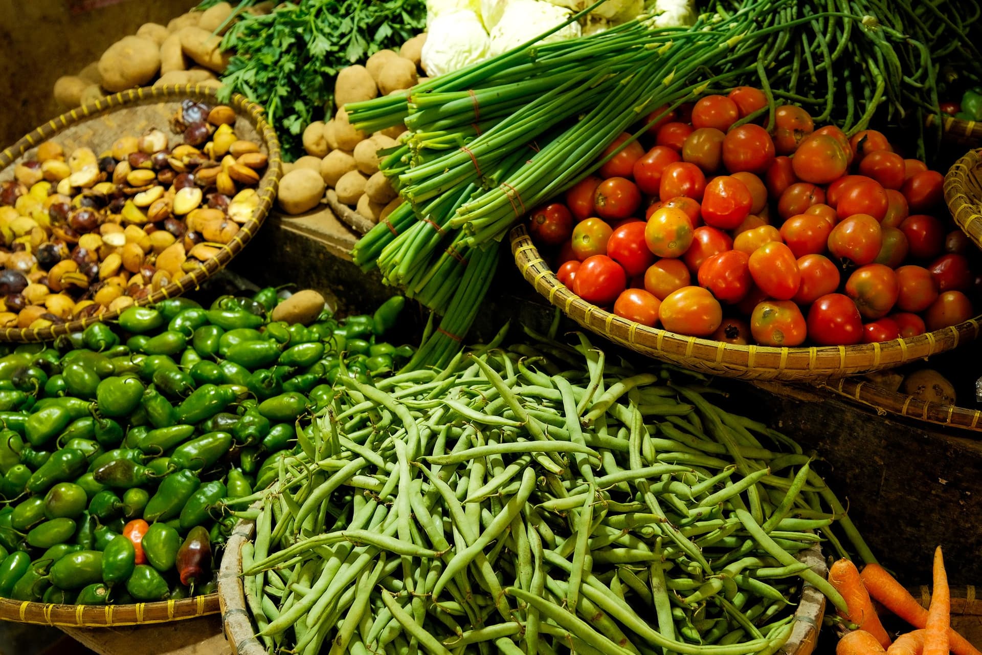Fresh vegetables and farmers at a local market